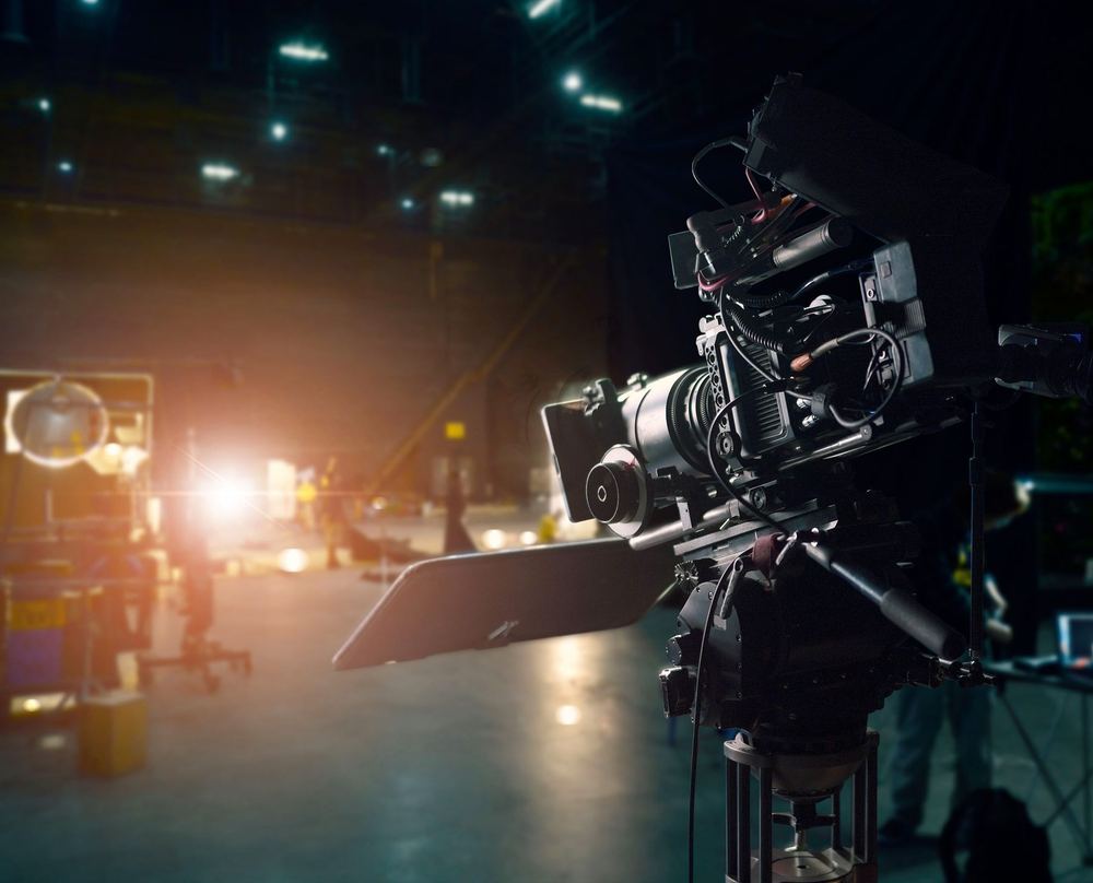 A broadcast camera rigged on a set